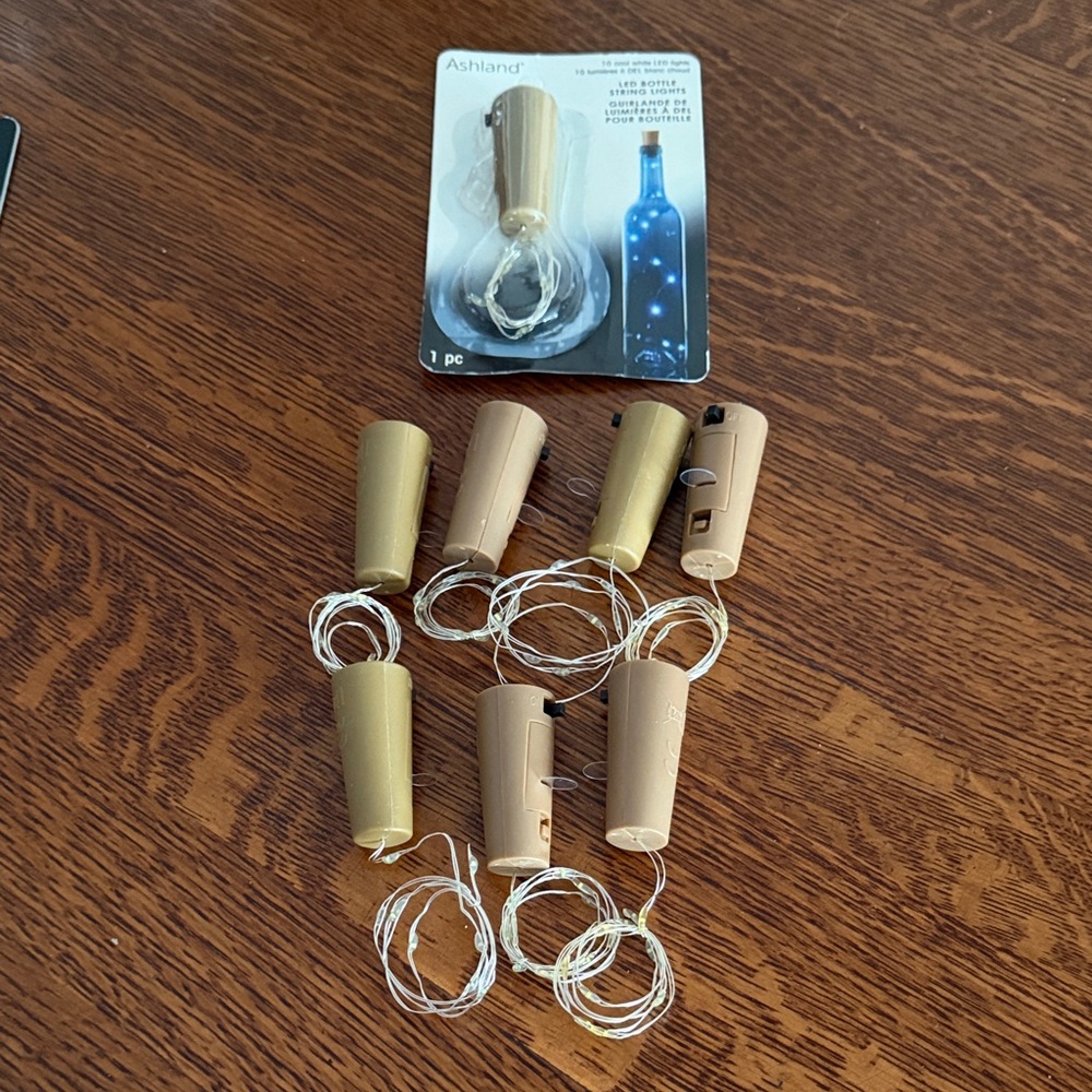 Ashland Bottle Cork String Lights in Gold and Tan Sold as a Set of 8